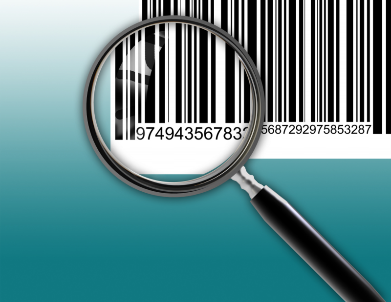 A magnifying glass hovers over the tracking number at the bottom of a barcode